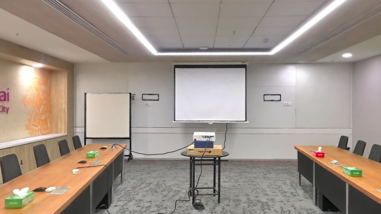 Recreated conference room with long tables and a projection screen