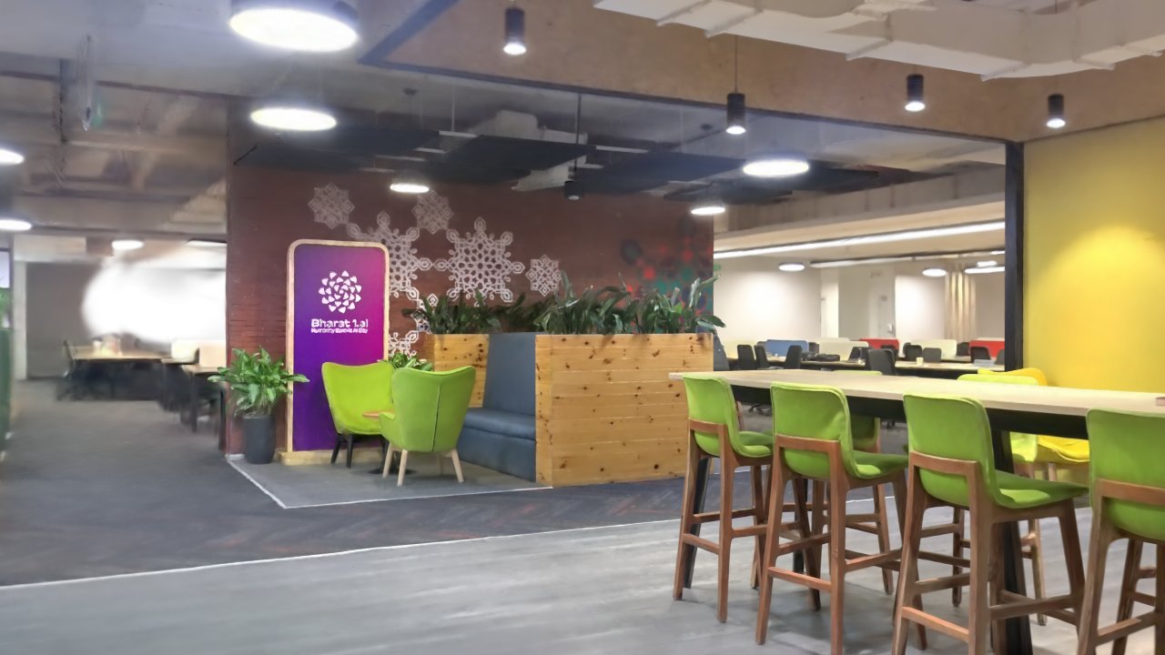 Recreated office entrance with lounge seating and shared tables