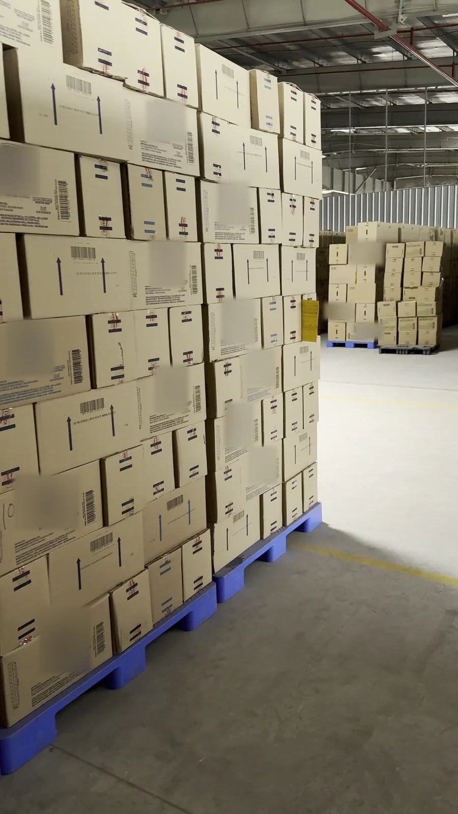 Real iPhone view 1 of the same warehouse aisle